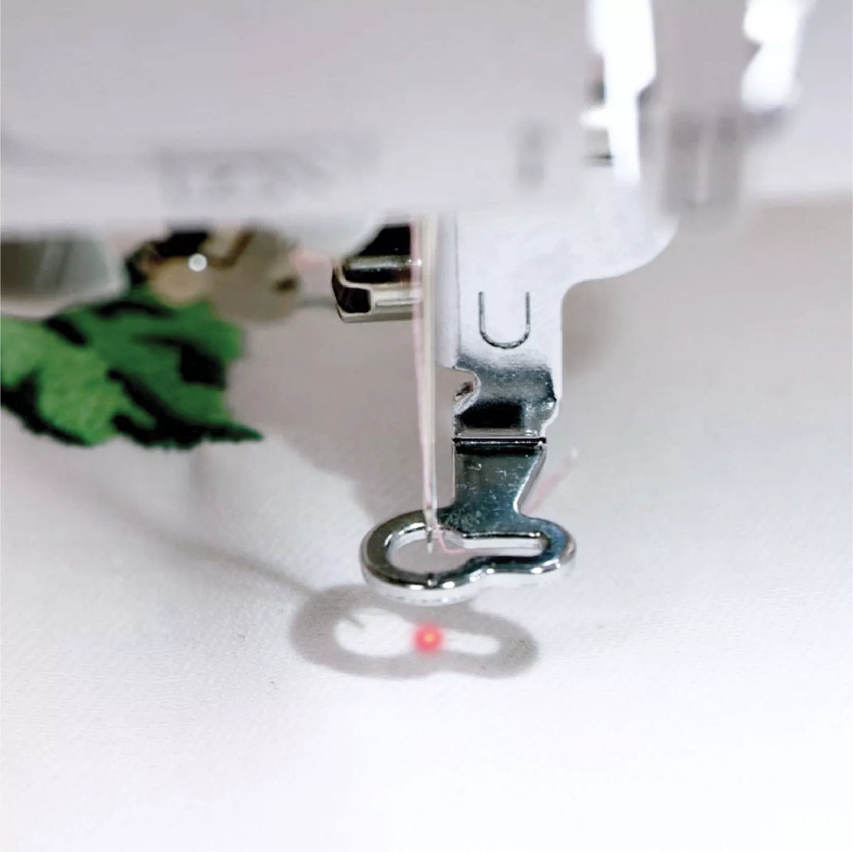 Brother NV2700 combination machine - droplight positioning marker showing needle drop point